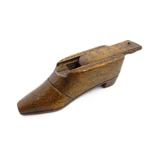 1154 - Treen : An early 19thC shoe snuff box with sliding lid and inlaid brass studwork decoration, dated 1... 