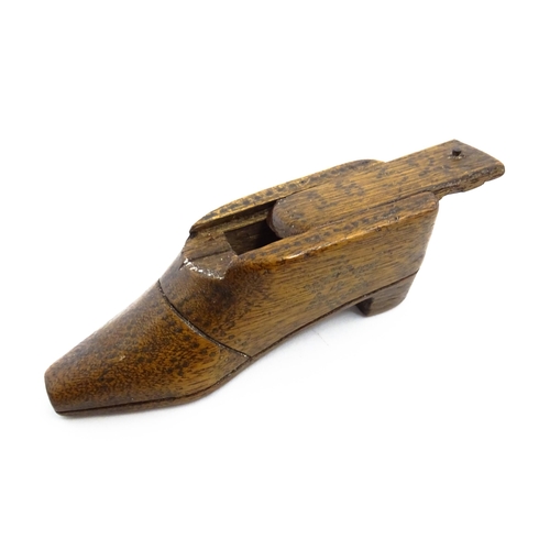 1154 - Treen : An early 19thC shoe snuff box with sliding lid and inlaid brass studwork decoration, dated 1... 