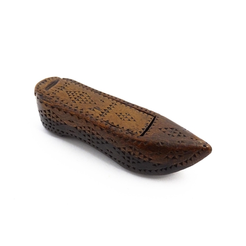 1155 - Treen : A 19thC Continental shoe snuff box with sliding lid and chip carved decoration. Approx. 3 1/... 