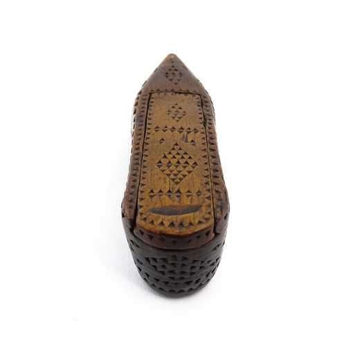 1155 - Treen : A 19thC Continental shoe snuff box with sliding lid and chip carved decoration. Approx. 3 1/... 