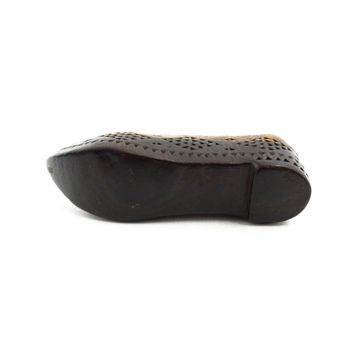 1155 - Treen : A 19thC Continental shoe snuff box with sliding lid and chip carved decoration. Approx. 3 1/... 