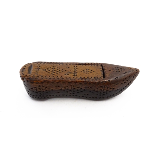 1155 - Treen : A 19thC Continental shoe snuff box with sliding lid and chip carved decoration. Approx. 3 1/... 