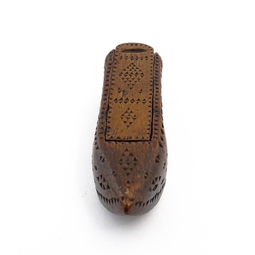 1155 - Treen : A 19thC Continental shoe snuff box with sliding lid and chip carved decoration. Approx. 3 1/... 