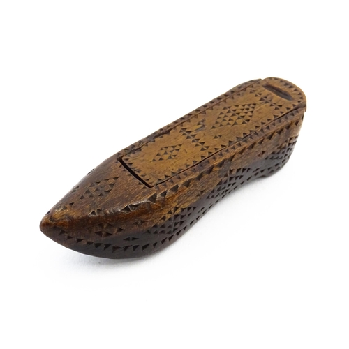 1155 - Treen : A 19thC Continental shoe snuff box with sliding lid and chip carved decoration. Approx. 3 1/... 