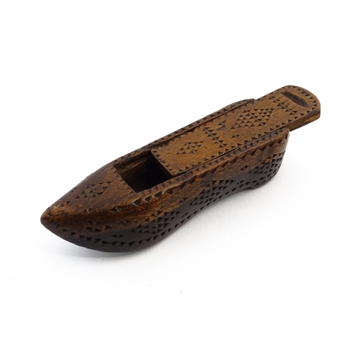 1155 - Treen : A 19thC Continental shoe snuff box with sliding lid and chip carved decoration. Approx. 3 1/... 