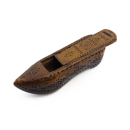 1155 - Treen : A 19thC Continental shoe snuff box with sliding lid and chip carved decoration. Approx. 3 1/... 