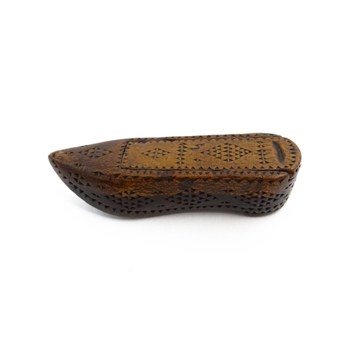 1155 - Treen : A 19thC Continental shoe snuff box with sliding lid and chip carved decoration. Approx. 3 1/... 