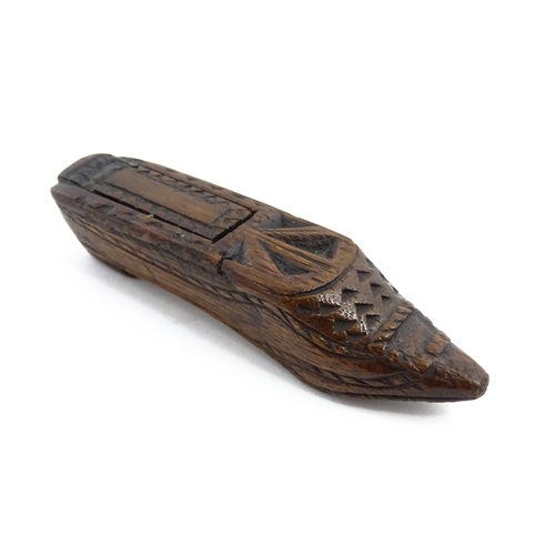 1156 - Treen : A 19thC Continental shoe snuff box with sliding lid and chip carved decoration. Approx. 4 3/... 