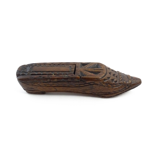 1156 - Treen : A 19thC Continental shoe snuff box with sliding lid and chip carved decoration. Approx. 4 3/... 