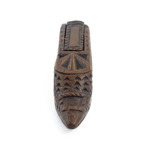 1156 - Treen : A 19thC Continental shoe snuff box with sliding lid and chip carved decoration. Approx. 4 3/... 