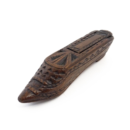 1156 - Treen : A 19thC Continental shoe snuff box with sliding lid and chip carved decoration. Approx. 4 3/... 