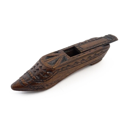 1156 - Treen : A 19thC Continental shoe snuff box with sliding lid and chip carved decoration. Approx. 4 3/... 