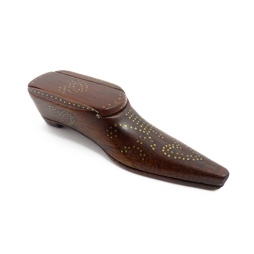 1157 - Treen : A 19thC shoe snuff box with sliding lid and inlaid brass heart studwork decoration. Approx. ... 