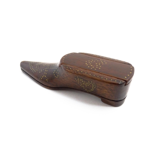 1157 - Treen : A 19thC shoe snuff box with sliding lid and inlaid brass heart studwork decoration. Approx. ... 