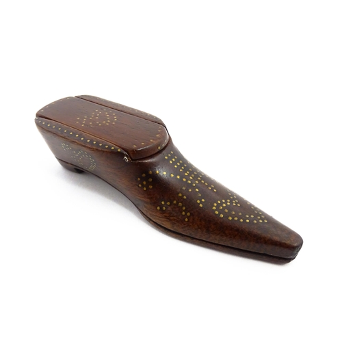 1157 - Treen : A 19thC shoe snuff box with sliding lid and inlaid brass heart studwork decoration. Approx. ... 