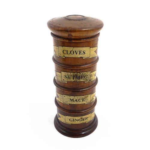 1163 - A four tier treen spice tower labelled Cloves, Nutmeg, Mace, and Ginger. Approx. 7 1/2