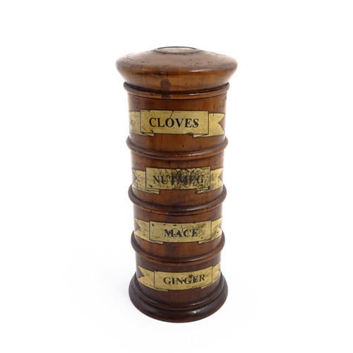 1163 - A four tier treen spice tower labelled Cloves, Nutmeg, Mace, and Ginger. Approx. 7 1/2