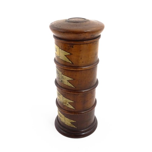 1163 - A four tier treen spice tower labelled Cloves, Nutmeg, Mace, and Ginger. Approx. 7 1/2