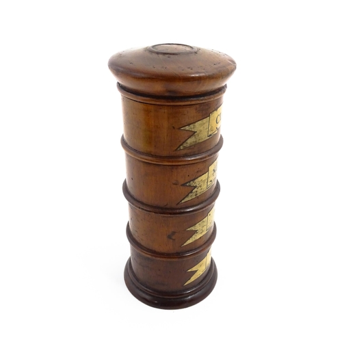 1163 - A four tier treen spice tower labelled Cloves, Nutmeg, Mace, and Ginger. Approx. 7 1/2