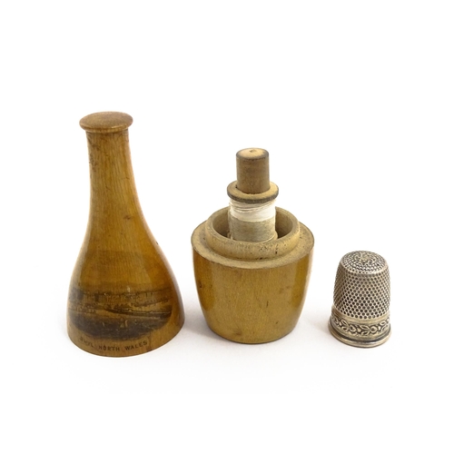 1164 - Sewing Interest: A 19thC Mauchline ware sewing companion comprising needle case, thread spool and th... 