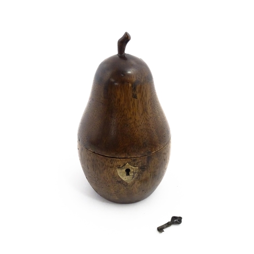 1165 - Treen : A fruitwood caddy formed as a pear. Approx. 7