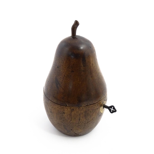 1165 - Treen : A fruitwood caddy formed as a pear. Approx. 7