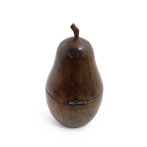 1165 - Treen : A fruitwood caddy formed as a pear. Approx. 7