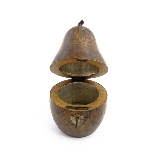 1165 - Treen : A fruitwood caddy formed as a pear. Approx. 7