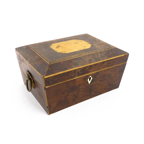 1171 - A 19thC burr yew workbox of tapering form with twin handles, and parquetry inlay to top. Opening to ... 