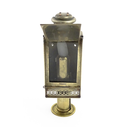 1181 - A 19thC lantern / hand lamp, the interior with spring-loaded candle, approx 8