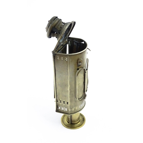 1181 - A 19thC lantern / hand lamp, the interior with spring-loaded candle, approx 8