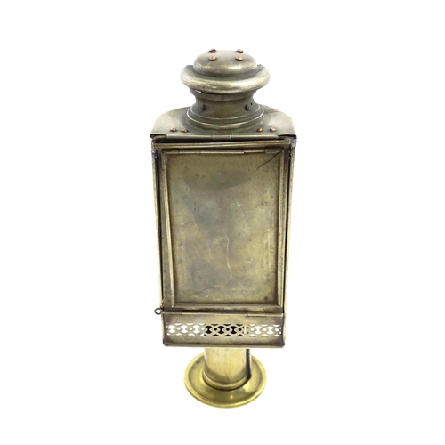 1181 - A 19thC lantern / hand lamp, the interior with spring-loaded candle, approx 8