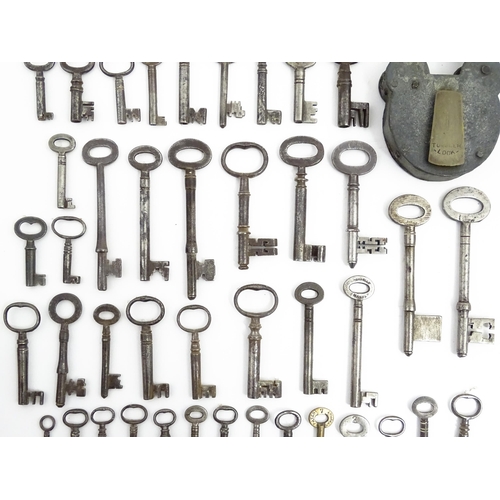 1183 - A quantity of assorted old keys, and a Tumbler padlock. Together with a book titled Keys Their Histo... 