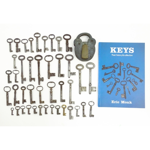 1183 - A quantity of assorted old keys, and a Tumbler padlock. Together with a book titled Keys Their Histo... 