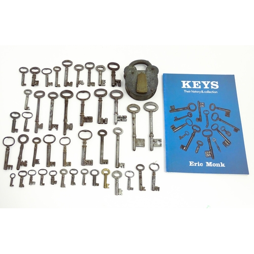 1183 - A quantity of assorted old keys, and a Tumbler padlock. Together with a book titled Keys Their Histo... 