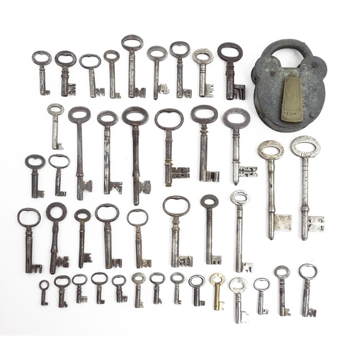 1183 - A quantity of assorted old keys, and a Tumbler padlock. Together with a book titled Keys Their Histo... 