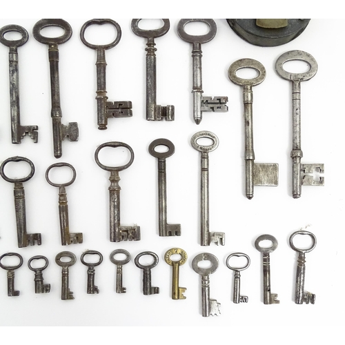 1183 - A quantity of assorted old keys, and a Tumbler padlock. Together with a book titled Keys Their Histo... 