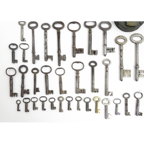 1183 - A quantity of assorted old keys, and a Tumbler padlock. Together with a book titled Keys Their Histo... 