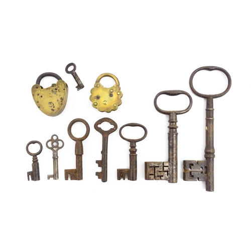 1184 - A quantity of assorted old keys. Together with a Victorian padlock, and another of shaped form with ... 