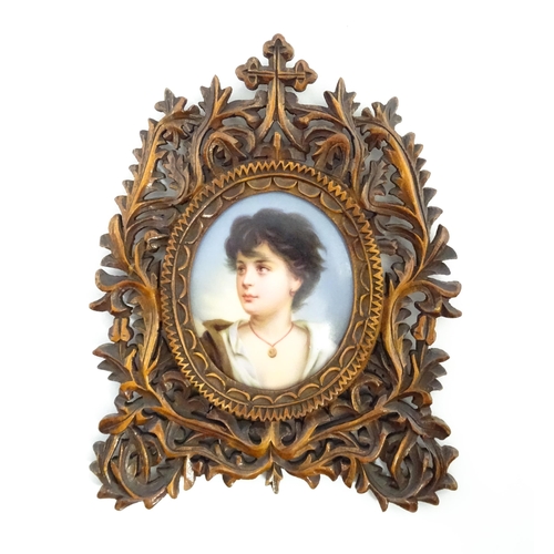 1188 - Three late 19th / early 20thC frames comprising a Black Forest style carved wooden frame with a hand... 