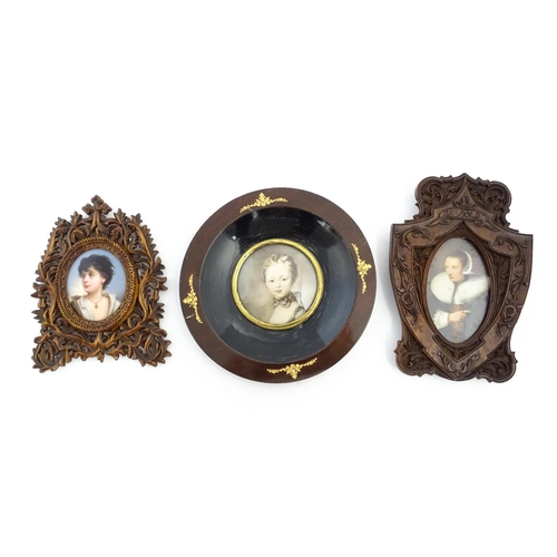 1188 - Three late 19th / early 20thC frames comprising a Black Forest style carved wooden frame with a hand... 