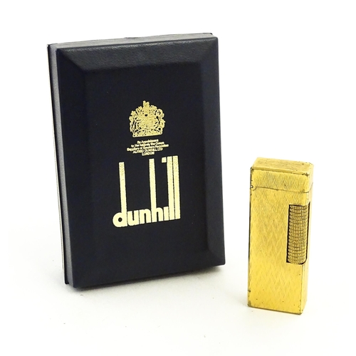 1197 - A c1970s Dunhill Rollagas lighter with chevron finish, cased with manual, approx 2 1/2