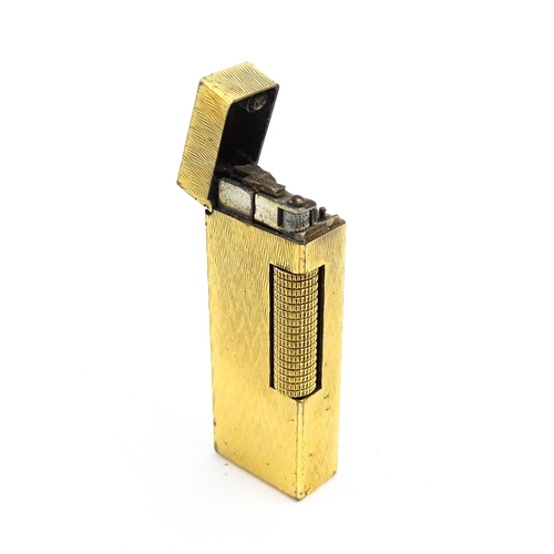 1197 - A c1970s Dunhill Rollagas lighter with chevron finish, cased with manual, approx 2 1/2