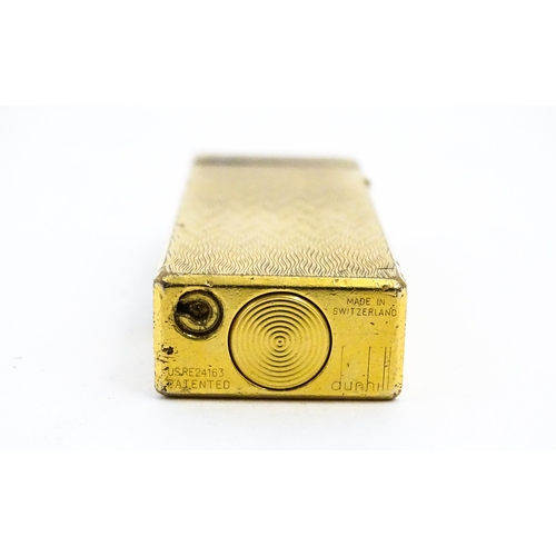 1197 - A c1970s Dunhill Rollagas lighter with chevron finish, cased with manual, approx 2 1/2