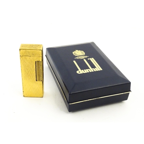 1197 - A c1970s Dunhill Rollagas lighter with chevron finish, cased with manual, approx 2 1/2