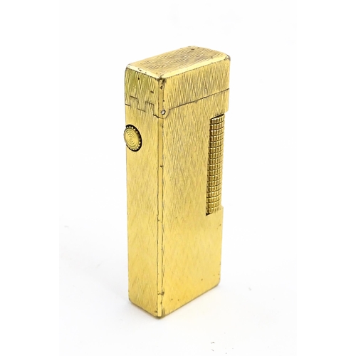 1197 - A c1970s Dunhill Rollagas lighter with chevron finish, cased with manual, approx 2 1/2