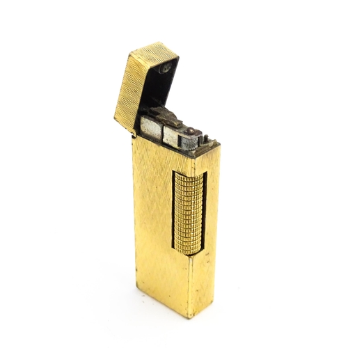 1197 - A c1970s Dunhill Rollagas lighter with chevron finish, cased with manual, approx 2 1/2