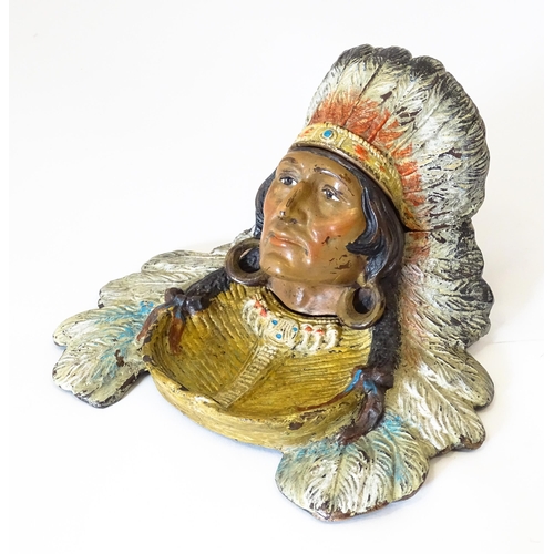 1199 - A late 20thC cast novelty inkwell formed as a Native American Indian with headdress. Approx. 4 1/4