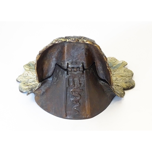 1199 - A late 20thC cast novelty inkwell formed as a Native American Indian with headdress. Approx. 4 1/4