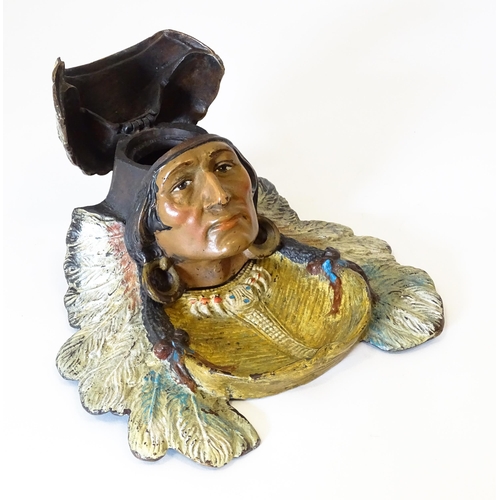 1199 - A late 20thC cast novelty inkwell formed as a Native American Indian with headdress. Approx. 4 1/4